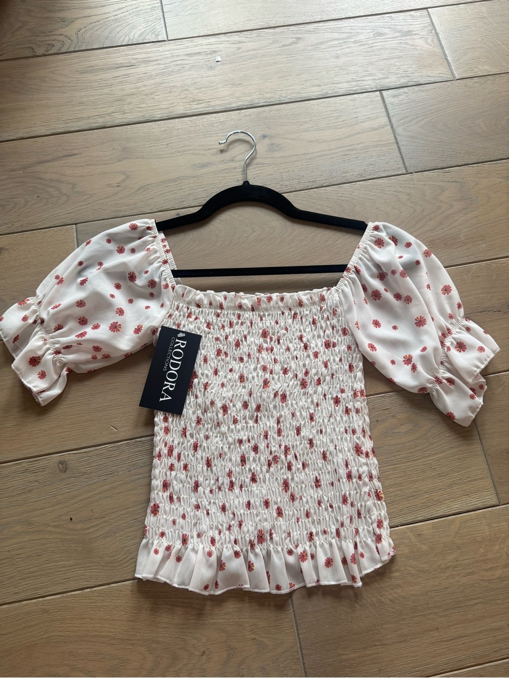 Off-shoulder top in white with red floral print
